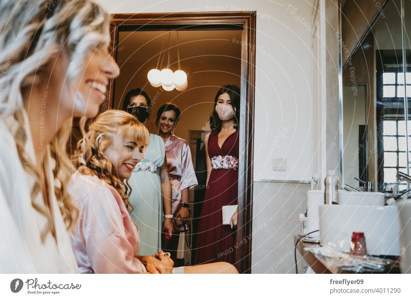 Group of bridesmaids with surgical masks before the wedding face face mask pandemic group engagement celebration friends female makeup preparing cute white girl