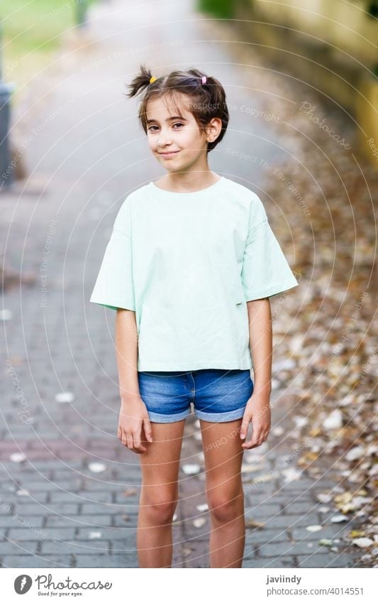 Nine-year-old girl standing in a city park female little child outdoor mockup cute lifestyle casual caucasian cheerful care single sitting beautiful leisure