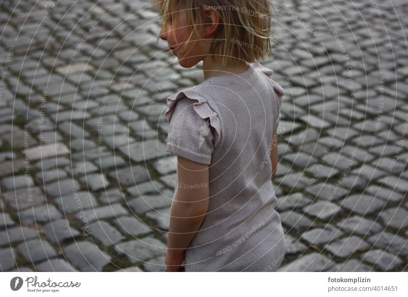 Child on a cobblestone path Paving stone Girl Playing Infancy portrait Exterior shot Small Cute youthful Parenting children Childlike Playground prohibition