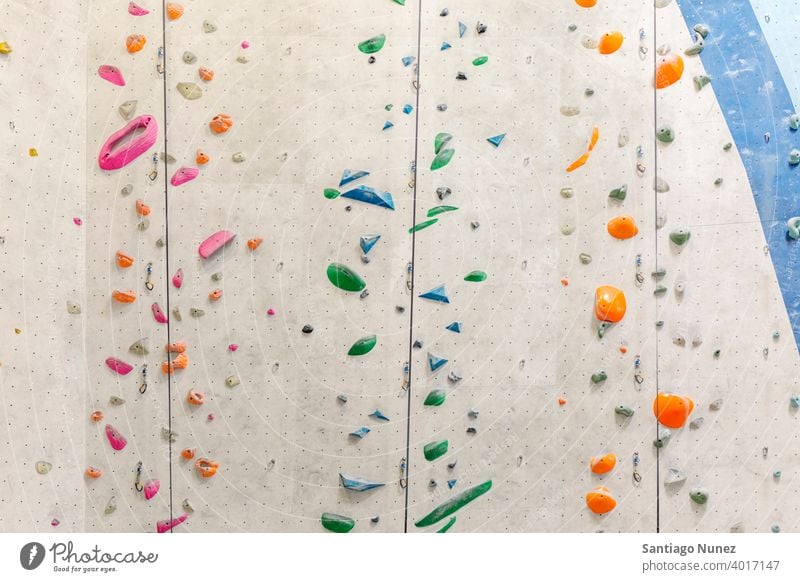 Colorful rock climbing wall. sport training leisure copy space extreme climber bouldering activity fitness indoor exercise challenge active risk up adult hobby