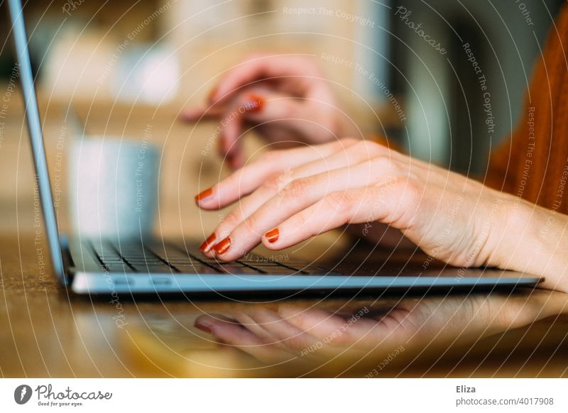 Woman hands typing something on the keyboard of a laptop at home Typing Keyboard Notebook home office Home Office Online labour Computer Workplace Internet