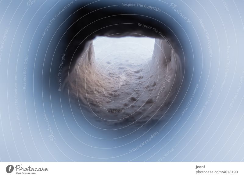 Through the small peephole of the igloo you can discover the tunnel of the entrance into the small cave Igloo Peephole Entrance Tunnel Small Narrow Hiding place