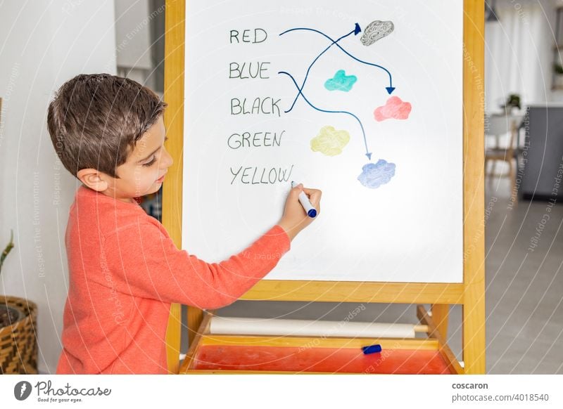 Little boy learning english with his mother at home abc alphabet blackboard chalkboard child childhood class classroom colors colours concept course education