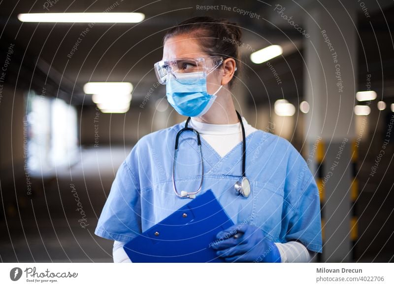 Portrat of a doctor in mobile testing center aid ambulance blue care caucasian clinic clipboard confident corona coronavirus covid covid-19 dispenser drive-thru