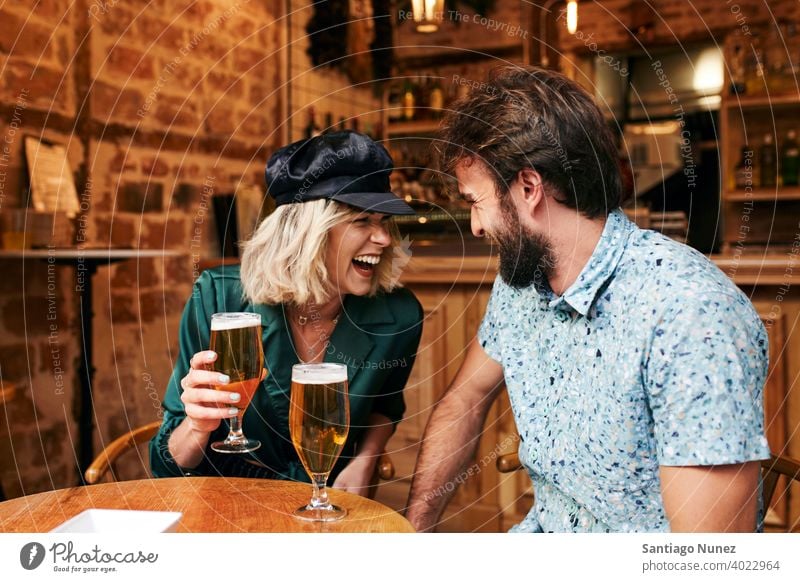 Caucasian couple having a drink at a bar. adult woman people happy female restaurant lifestyle two caucasian beautiful happiness together smile boyfriend