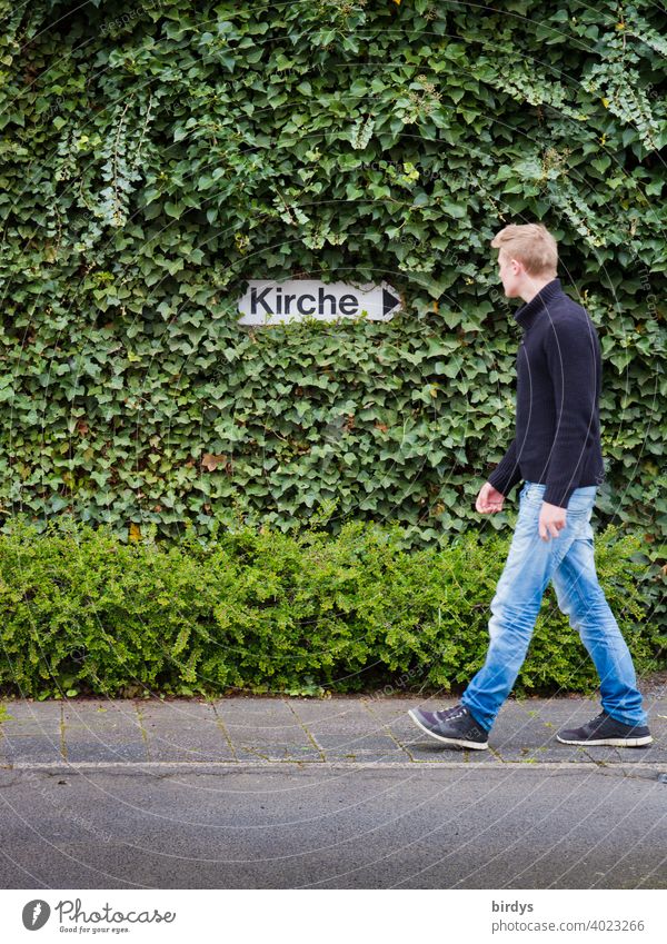 Young man turns away from church and walks in opposite direction. Church exit, directional sign "church" framed by ivy leaving the church Anger child abuse