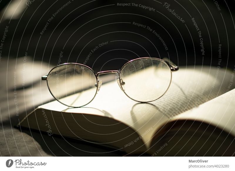 Glasses on a book. Reading a book. Knowledge. Wisdom Book Reading glasses studying Education Eyeglasses Study Literature Library Information