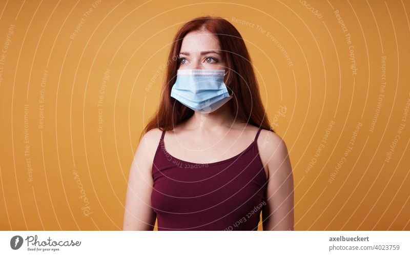 young woman with medical mask - mouth-nose-protection Young woman Woman Mask mouth-nose protection pandemic Protection corona Corona virus Risk of infection
