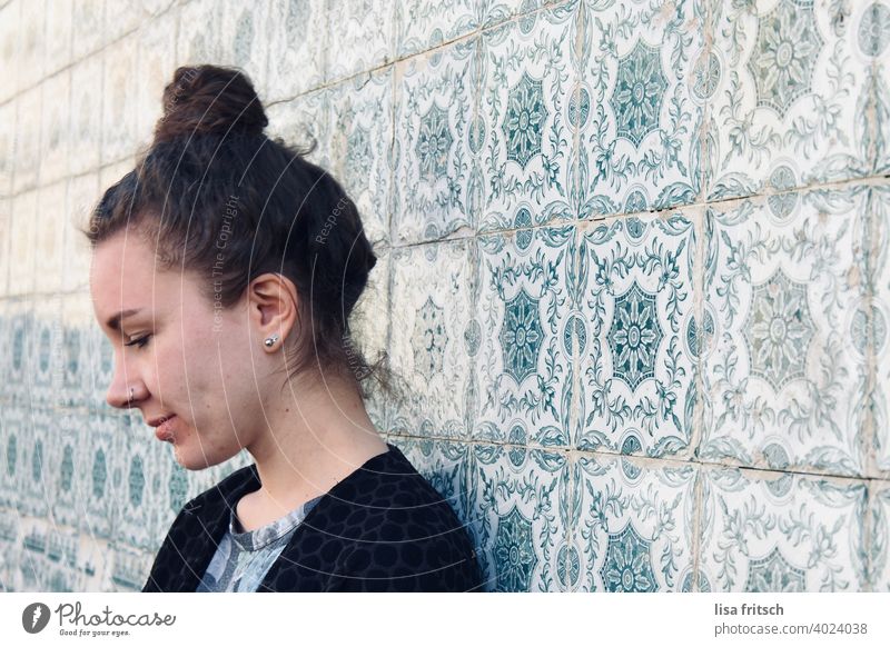 TILE MIRROR - WOMAN - LOOK DOWN Tile Portugal travel Vacation & Travel Woman Chignon Brunette 25-29 years eyes closed Grinning Nasal piercing Exterior shot