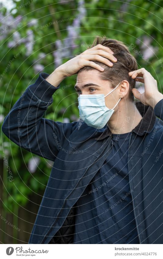 Teen in protective mask grabs her forehead teenager younger Outdoors Summer youthful coronavirus covid-19 COVID Corona virus Virus Healthy Risk of infection