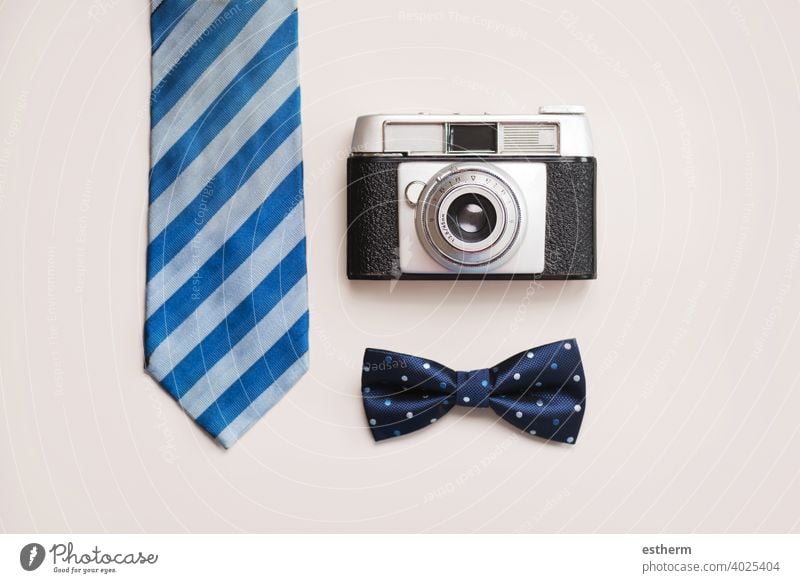 Happy Father's Day.Tie, bow tie and retro photo camera father's day dad dady family celebration son daughter fatherhood present background festive presents