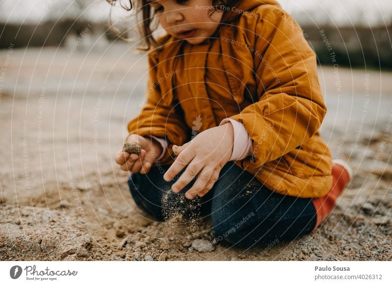 Child playing with rocks and sand Winter Autumn Authentic Playing 1 - 3 years Human being Toddler Happiness Day Nature Colour photo Joy Exterior shot Infancy