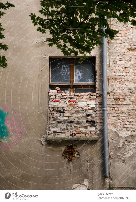 half-window walled up Window stonewalled Facade Brick lost places Ravages of time Change Apocalyptic sentiment Downpipe Weathered Downtown Berlin Authentic