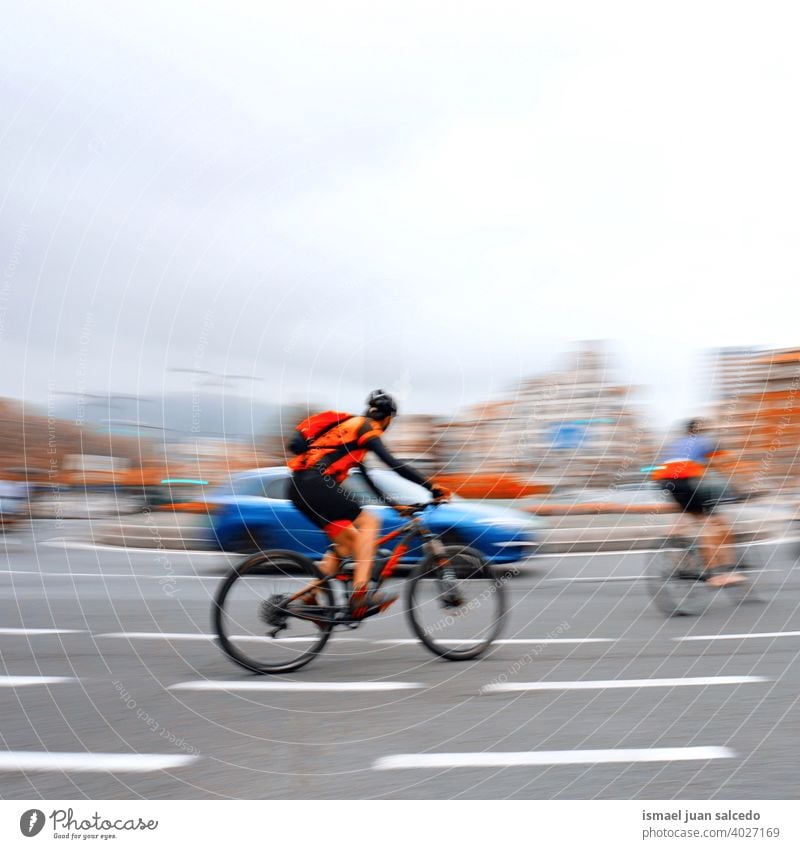 cyclist on the road in Bilbao city, Spain biker bicycle transportation cycling biking exercise ride speed fast blur blurred motion movement defocused street