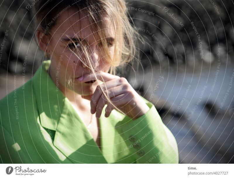 Lara Woman Looking Blonde hair Meditative Jacket Green Neon green Hand stones bank Water