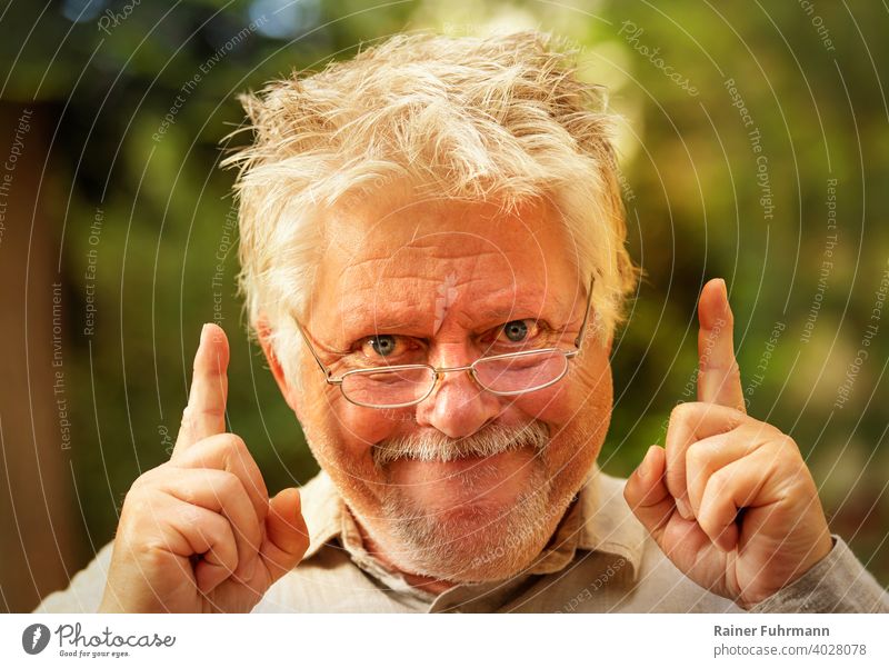 a strange man with glasses suddenly has an idea incursion Idea Awareness Inspection discovery portrait Man Eyeglasses mazy Grinning Joy Fingers Indicate out