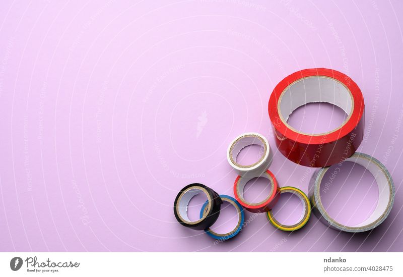 Two rolls of double-sided sticky tape on a blue background, top view Stock  Photo by ndanko