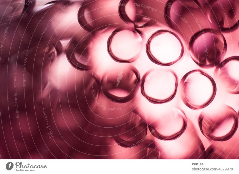 Tube-like red blurred squiggles with light Pipe whorls Round Red Light Structures and shapes Circle Abstract blurriness Soft Illuminate Background picture Straw