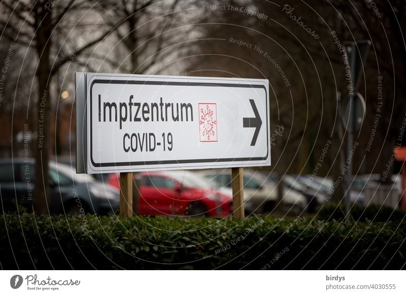 Directional sign, signpost to Covid-19 vaccination center, vaccination, writing, symbol and arrow. covid-19 vaccination centre corona inoculate sb. Vaccination