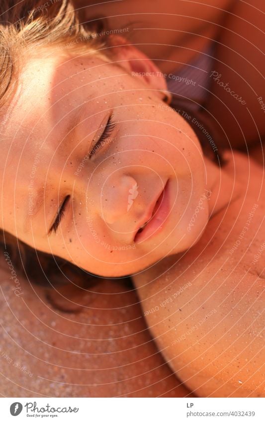 Beautiful child with eyes closed and sandy face Closed eyes Front view Portrait photograph Sunbeam Contrast Shadow Light Copy Space bottom Copy Space top