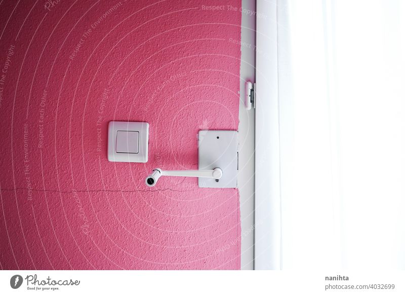 Minimal details in white in a pink room background texture decor home paint wall wallpaper minimal minimalistic shape lines composition crank handle switch key