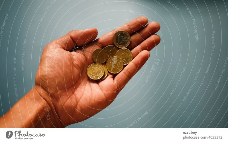 hand holding coin currency finance europe metal business money economy gold investment success wealth background closeup european bank cash cent coins savings