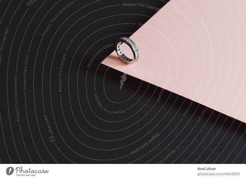 A diamond ring minimalistic shot over a pink and black background jewellery gold jewelry luxury crystal stylish expensive glamour necklace pair romance shiny