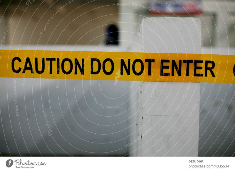 the caution do not enter yellow black line sign attention danger crime tape warning criminal barricade barrier construction scene restricted safety security law