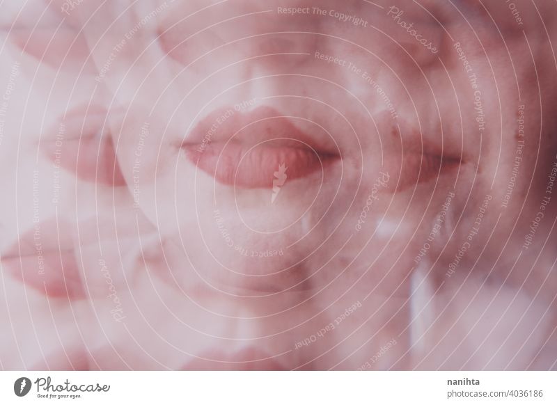 Distorted image of a young woman face view througn a prism beauty abstract lips makeup make up reflection reflected distortion distorted blur blurry focus