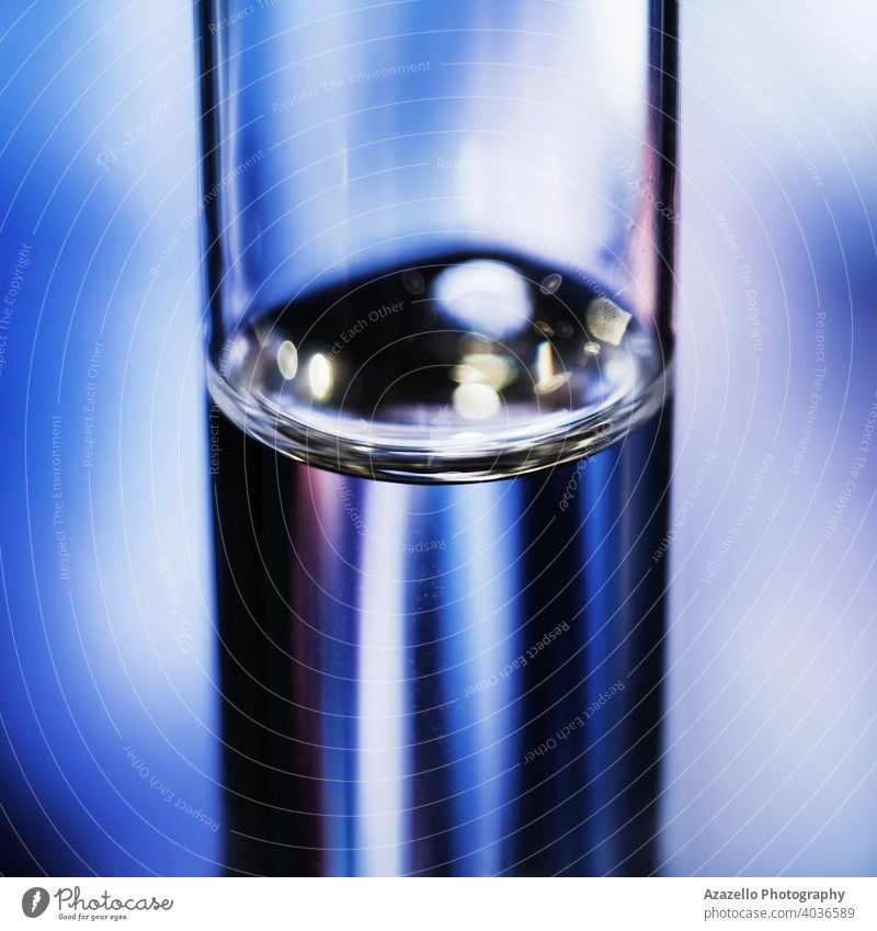 An ampoule with medicine in blur. Ampoule in blue. air ampul ampule background biology blurry bottle care closeup concept container dose equipment farina fluid
