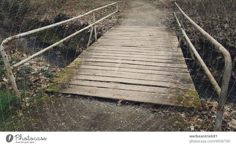 Weathered old wooden bridge with rusty railings weathered damaged park path way walking parkland nature leisure outdoor landscape travel water river forest