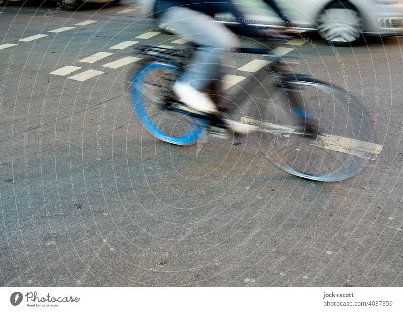 Mobility by bike or car across the crossing Bicycle cyclist Street Crossroads Transport Traffic infrastructure Means of transport motion blur Driving Speed Car