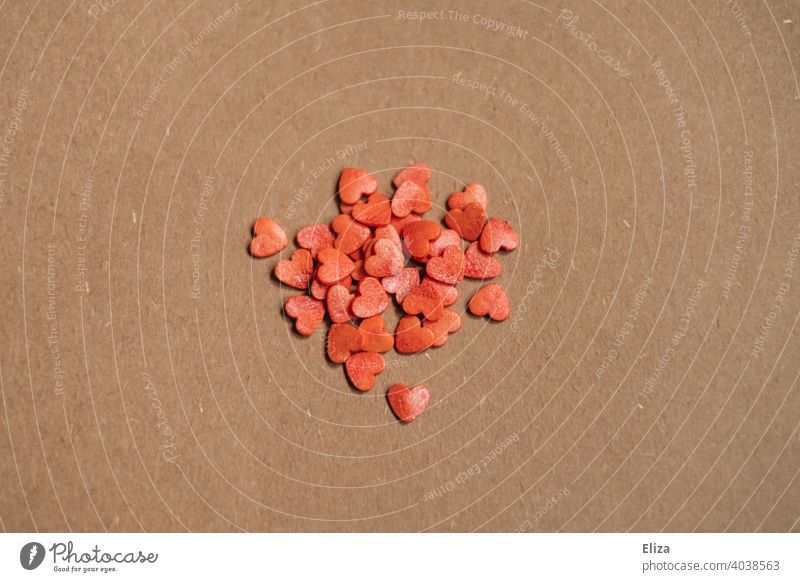 Small red hearts on brown background cuddle Love In love Emotions Red Paper Brown Heart Romance Heap Valentine's Day