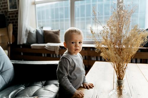 small boy looking at camera adorable baby babyhood blonde boys child childhood cute emotions explore exploring expression family fun happiness happy