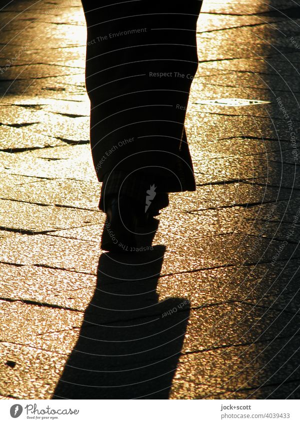 2800 steps on track not quite level Silhouette Dark Contrast Human being Sidewalk evening light Sunlight Shadow play Back-light Pedestrian Paving tiles Uneven
