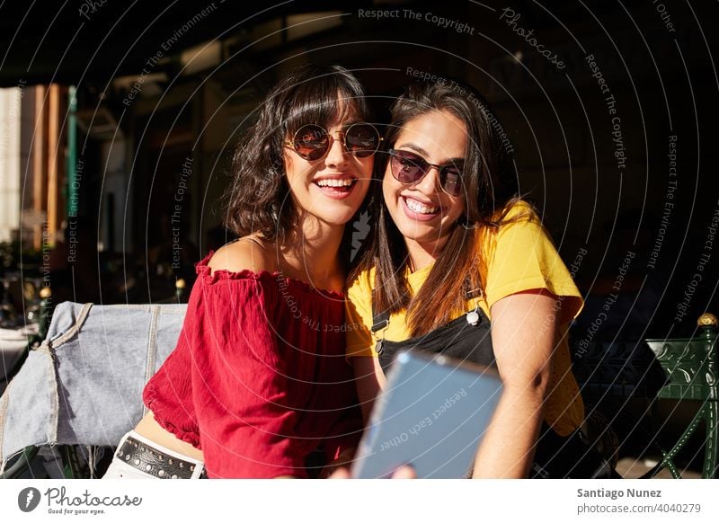 Two teenager girls taking a selfie. madrid young people friendship lifestyle beautiful fun happy together leisure woman smiling teens cheerful female youth