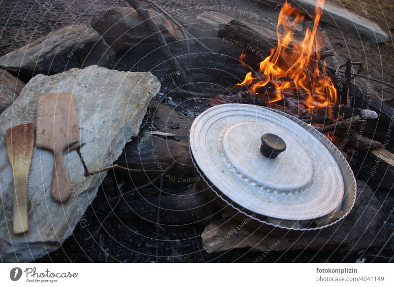 Campfire with pan and cooking utensils campfire boil Fire Fireplace Flame Pan Cooking Wooden spoon Adventure adventurous Wild Quaint Camping Primordial