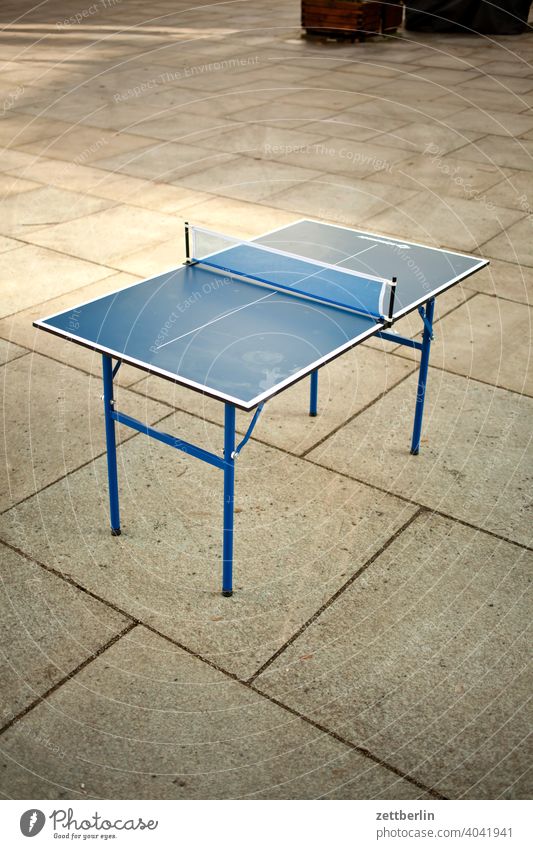 table tennis table Disinterest Going off walkway slab kinderladen Markets Human being Passer-by Places game Playground Sports Table tennis Table tennis table