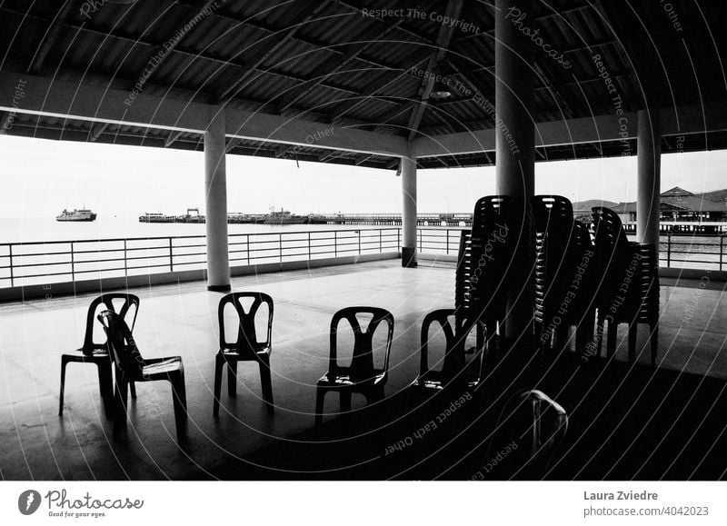 Have a rest before the trip chairs Pile of chairs Chair Seating Sit Furniture Empty Many Loneliness no people Row of seats Roof Under the roof ships