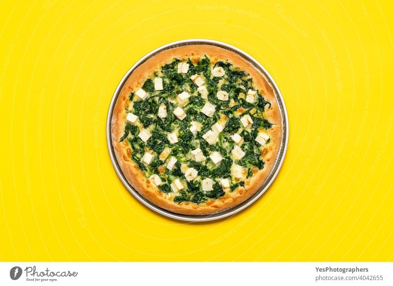Vegetarian pizza top view. Spinach pizza with mozzarella and feta cheese above view background baked crust cuisine cut out delicious dinner eating fast food