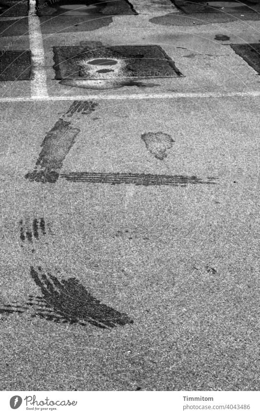 Let's go... and leave traces Parking lot Puddle wet Tracks Tire Skid marks Street Wet Deserted Asphalt Black & white photo Gray White