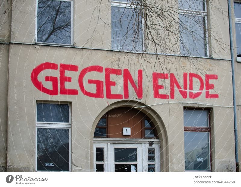 AGAINST END Facade Town house (City: Block of flats) Action for Eviction saying Word German Capital letter Subculture Window Entrance House number