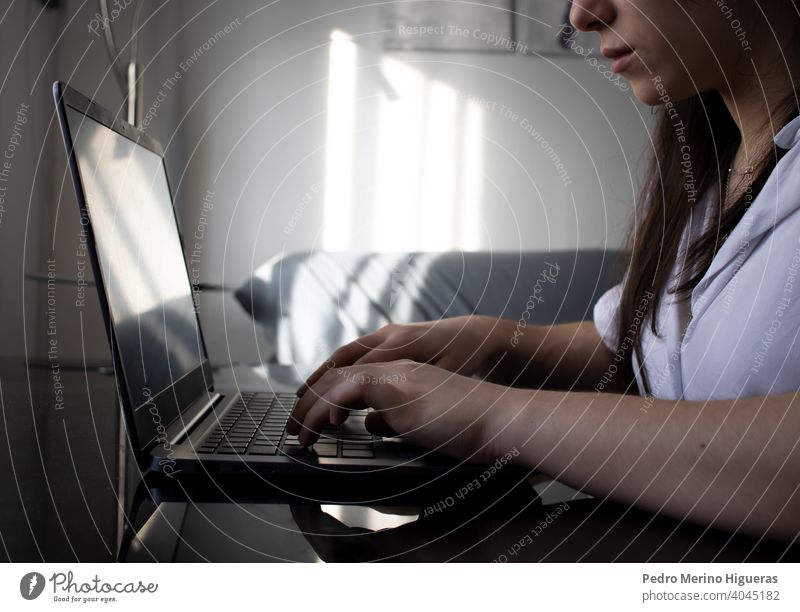 Woman using her laptop at home. freelancer office hand business woman education cyberspace female computer job work workplace programming communication working