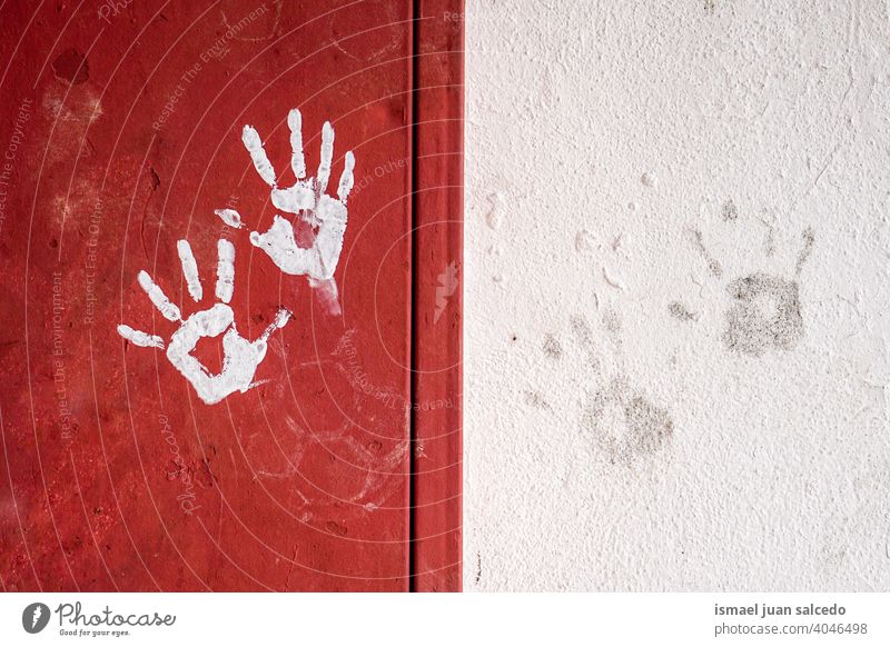 hand prints on the red and white wall hands stone old dirt dirty street background textured Colour photo Wall (barrier) Wall (building) Architecture Detail