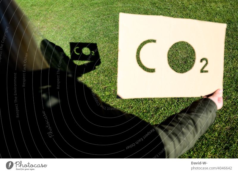CO2 - Environment - Shadow and Word on a Sign co2 CO2 emission Environmental pollution sign sustainability concept Air pollution Climate change Carbon dioxide