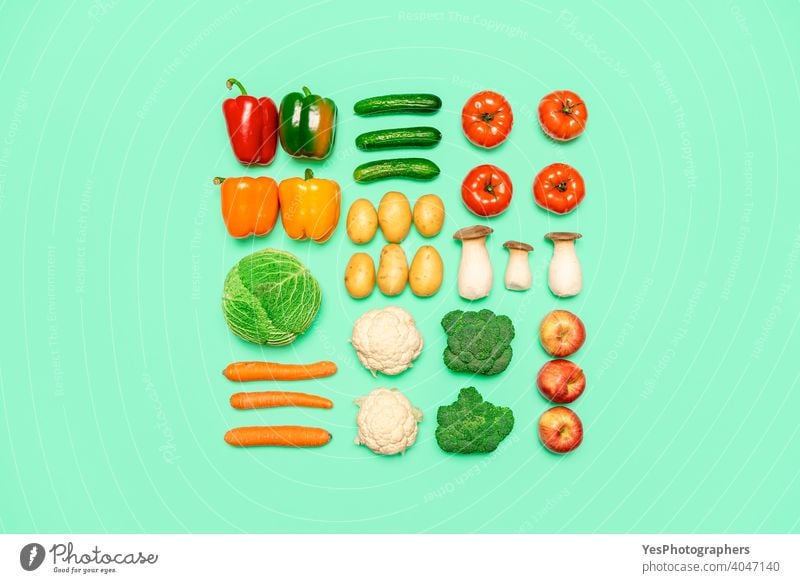 Vegetables and fruits symmetry, isolated on a colored background, top view.  Healthy food concept - a Royalty Free Stock Photo from Photocase