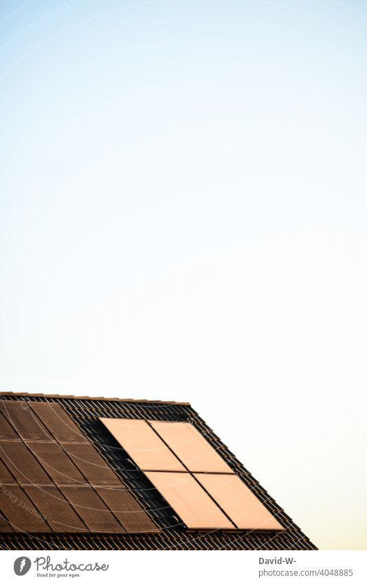 Solar cells / photovoltaics on the roof illuminated by sunlight photovoltaic system Sunlight Roof light energy Renewable energy Eco-friendly