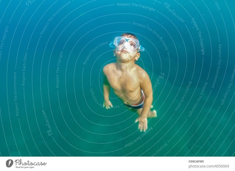 Little kid snorkeling on the ocean active active boy aqua beach beach vacation child childhood clear clear ocean coral reef deep down dive diving enjoy nature
