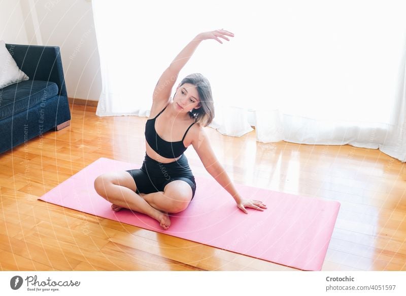 Girl practicing yoga in her living room 20s at childbirth class contemplation cuddling embracing energetic exercising father friends graceful healthcare