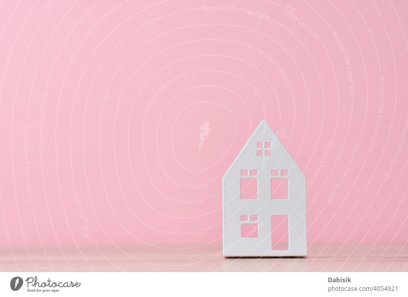 Figure of toy house on a pink background with copy space concept figure housing home building property wooden investment loan mortgage business residential